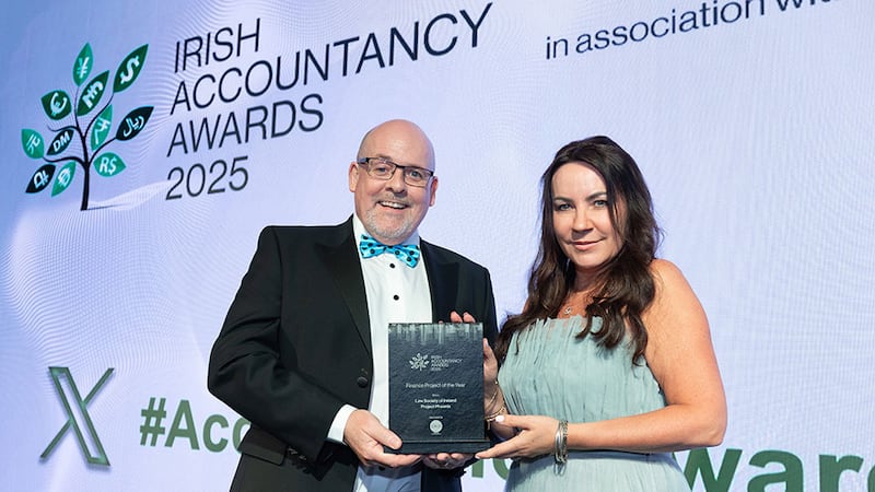 Alan Connor, managing director, Iplicit Ireland, presents the finance project of the year award to Gillian Cregan, Law Society of Ireland