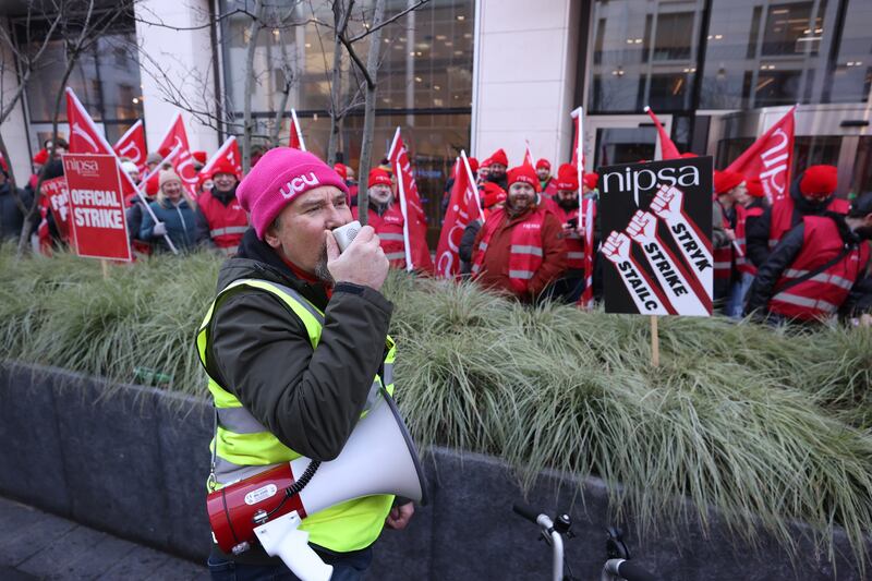 Prof John Barry, from the University Colleges Union, addresses the picket line outside the Northern Ireland Office at Erskine House, Belfast. Photograph: Liam McBurney/PA Wire