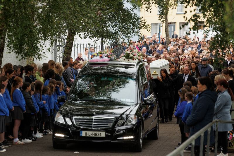 Hundreds lined the streets of Carndonagh town centre as the funeral cortege made its way to the church. Photograph: Liam McBurney/PA Wire 