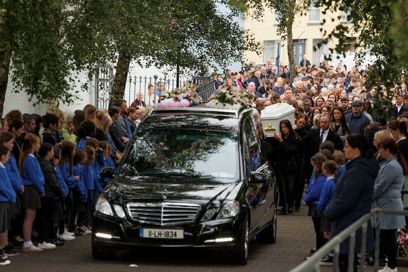 Hundreds lined the streets of Carndonagh town centre as the funeral cortege made its way to the church. Photograph: Liam McBurney/PA Wire