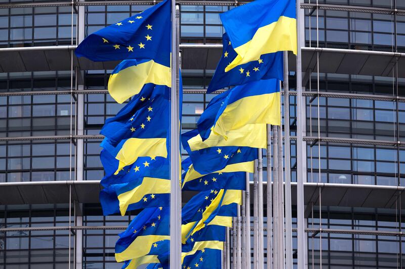 EU and Ukrainian flags fluttering outside the European Parliament in Strasbourg to mark the first anniversary of the Russian invasion of Ukraine. Photograph: Patrick Hertzog/AFP