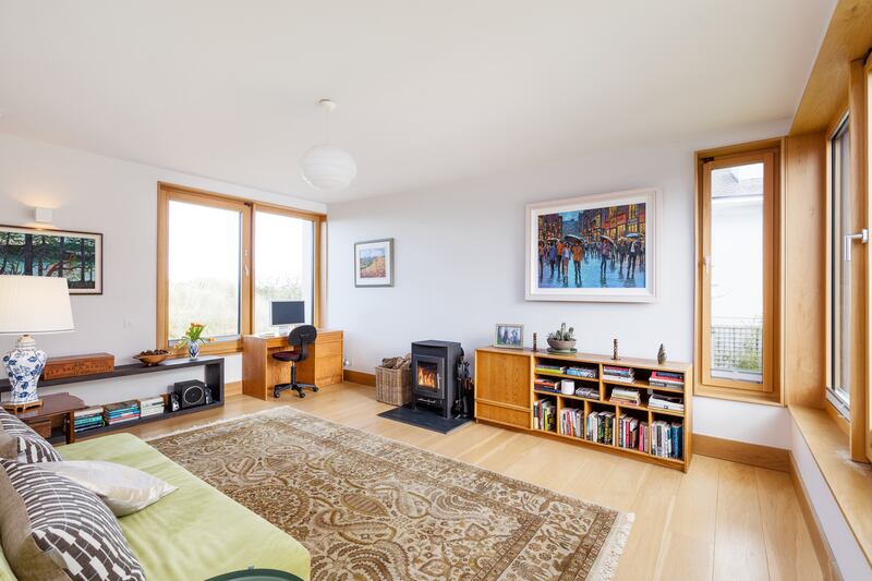 First-floor livingroom with stove or possible fourth bedroom