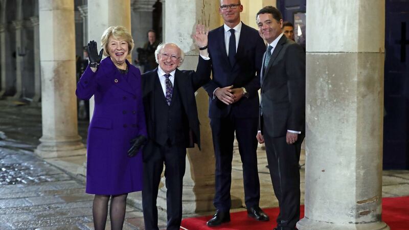 Michael D Higgins and his wife Sabina are greeted by Tánaiste Simon Coveney and Minister for Finance Paschal Donohoe at Dublin Castle. Photograph: Niall Carson/PA Wire