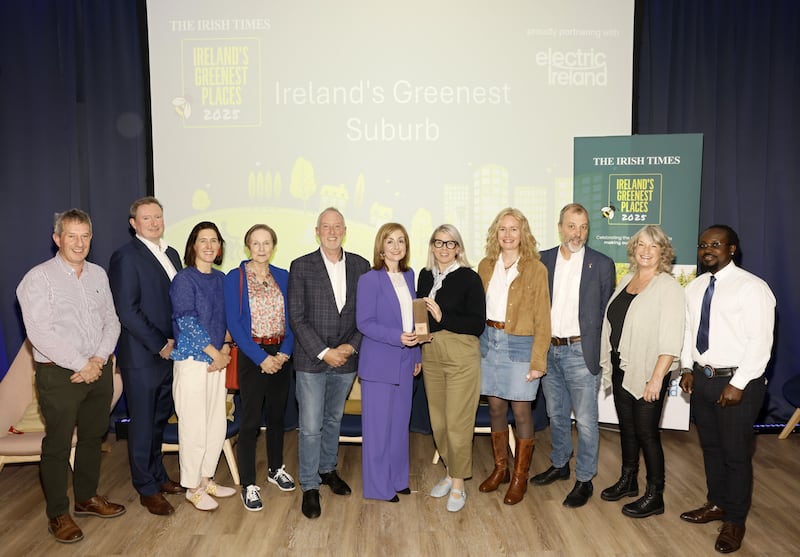 Claire Macken from Dún Laoghaire, Co Dublin accept the award for Ireland's Greenest suburb from one of the judges, Mary Minihan. Photograph: Kieran Harnett