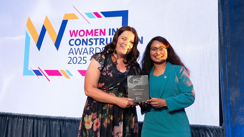 Breda Gleeson, chief operating officer at FKM Fit Out, presents the rising star of the year award to Ramya Janardhan, McElroy Associates