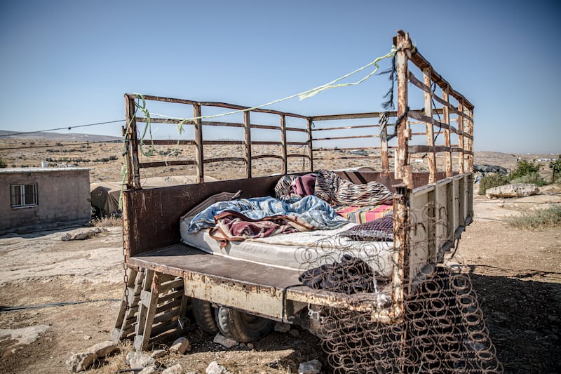 The truck where Imran Nawaja’a's wife sleeps at night to protect their animals from settlers. Photograph: Sally Hayden