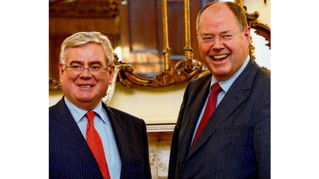 Eamon Gilmore with Peer Steinbrück on Sunday: Ireland should be able to rely on EU commitments from last June.