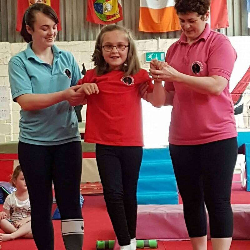 Coach Michelle Mooney, Scarlett, and Clare Sheehan.