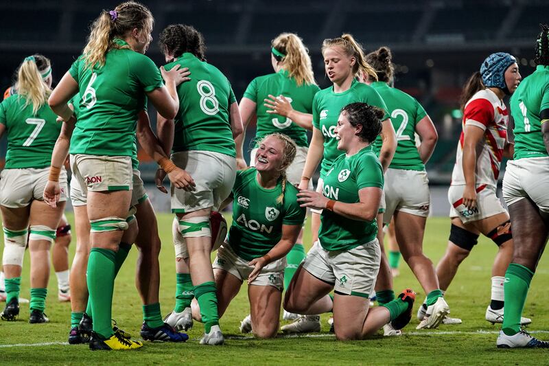 The Ireland team celebrate around Neve Jones after she scores a try. Photograph: Akito Iwamoto/Inpho