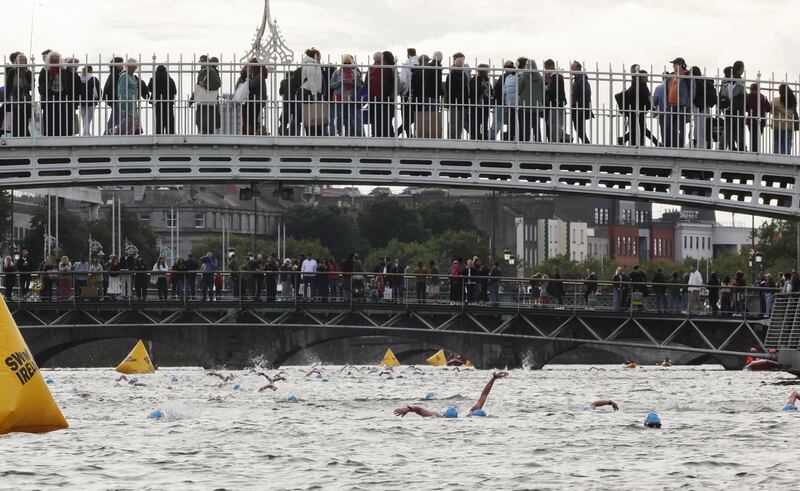 Under the Ha'penny bridge, the swimmers now have O'Connell Bridge in their sights. Photograph: Alan Betson 
