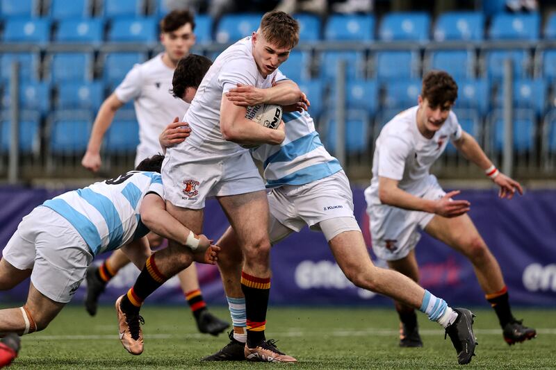 Pres Bray's Finn Treacy is held up by the Blackrock College defence. Photograph: Ben Brady/Inpho