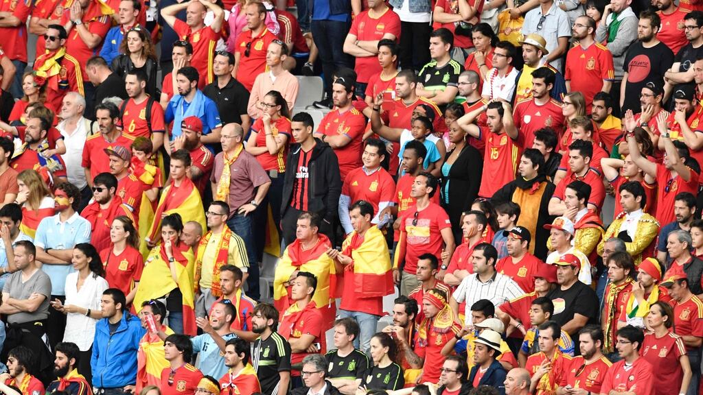 Spanish fans watch the defeat to Italy at the Stade de France stadium. Photograph: Getty Images