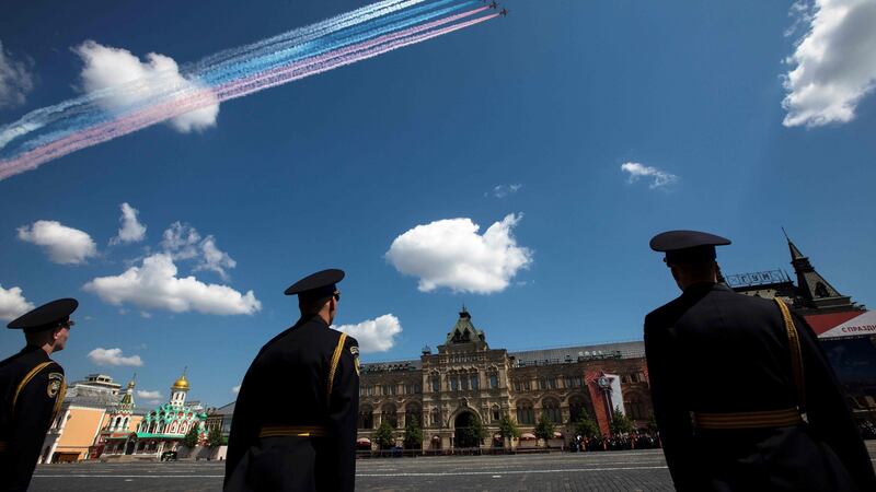 Sukhoi Su-25 assault aircrafts release smoke in the colours of the Russian flag over Red Square. Photograph: Pavel Golovkin/POOL/AFP via Getty Images