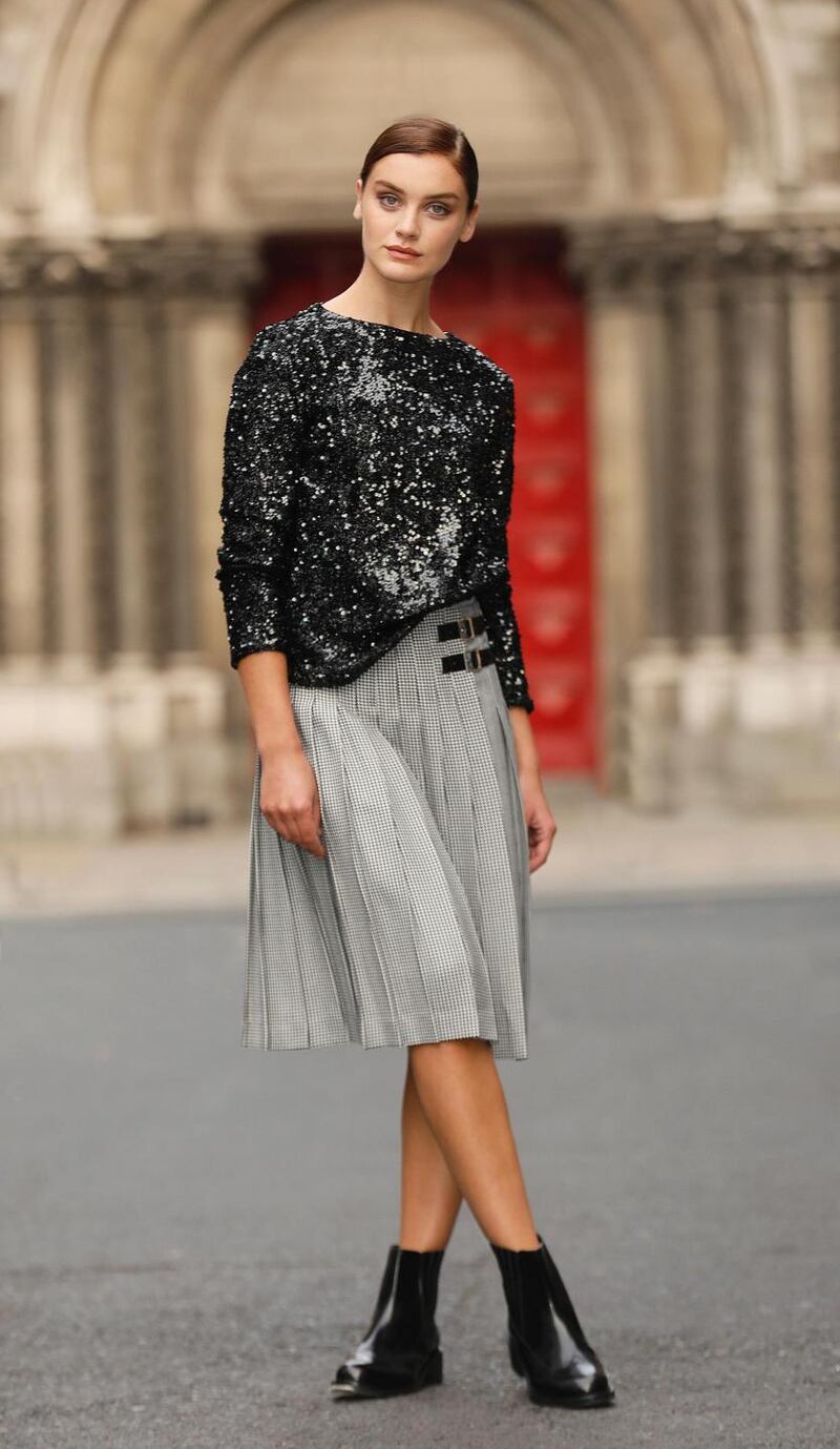Per Una sparkly round neck long sleeve top, €54;  Checked pleated midi skirt, €70