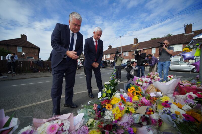 Ambassador of Liverpool FC, Ian Rush (right), and the ambassador of Everton FC, Ian Snodin, visit the scene in Kingsheath Avenue, Knotty Ash, Liverpool. Photograph: PA