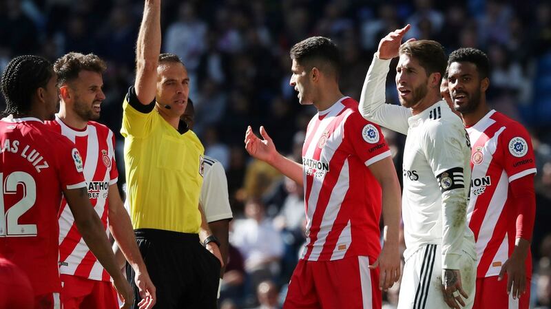 Sergio Ramos is shown a red card by referee Guillermo Cuadra in injury time. Photo: Susana Vera/Reuters