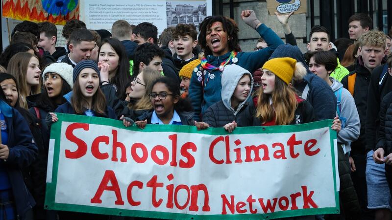 School pupils take part in a students’ climate strike outside Leinster House. Photograph  Crispin Rodwell