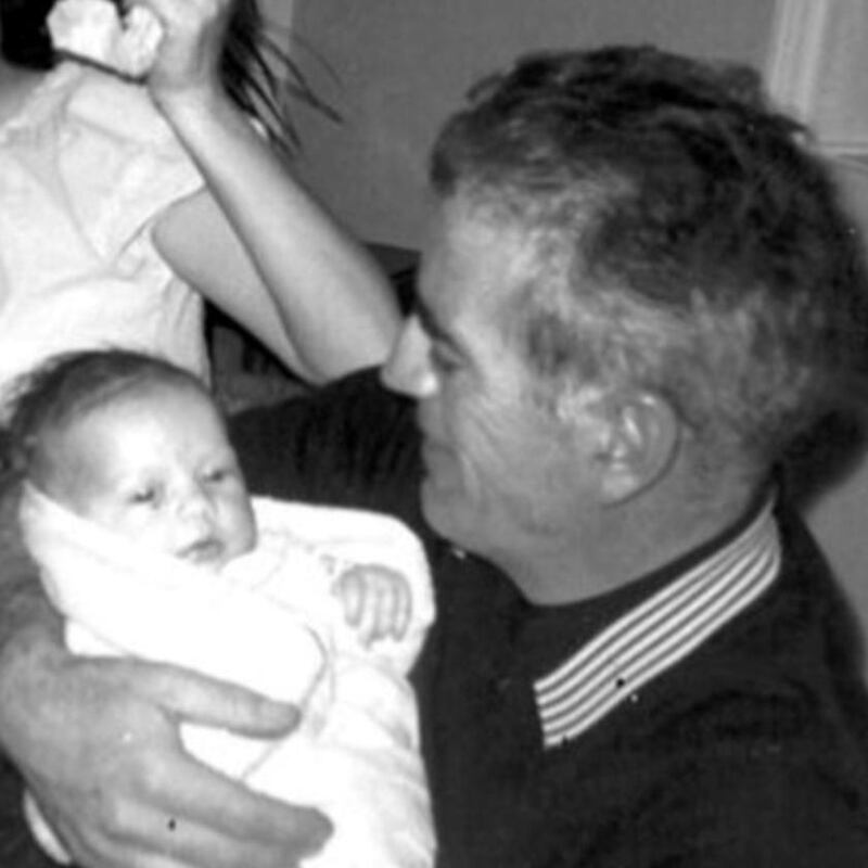 My father holding me as a baby