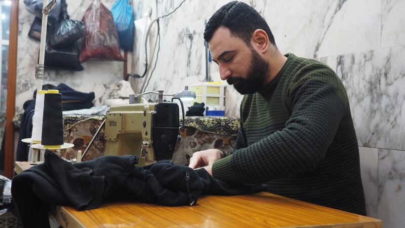 Ahmed Namiq Salim, a tailor working at al-Quds market on the east bank of the Tigris in Mosul. Photograph: Lorraine Mallinder