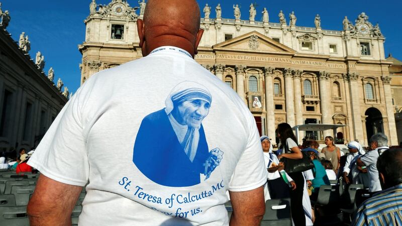 A man wears a t-shirt with the image of Mother Teresa of Calcutta before a mass celebrated by Pope Francis for her canonisation in Saint Peter’s Square at the Vatican on Sunday. Photograph: Reuters