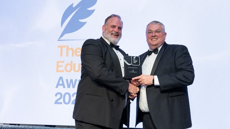 Graham Heaslip, awards judge, presents the career impact strategy award to Dr Michael Tobin, TUS