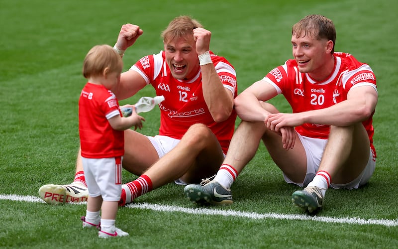 Louth’s Conor Grimes (left) and his daughter Izzy celebrate with Ciaran Byrne. Photograph: James Crombie/Inpho