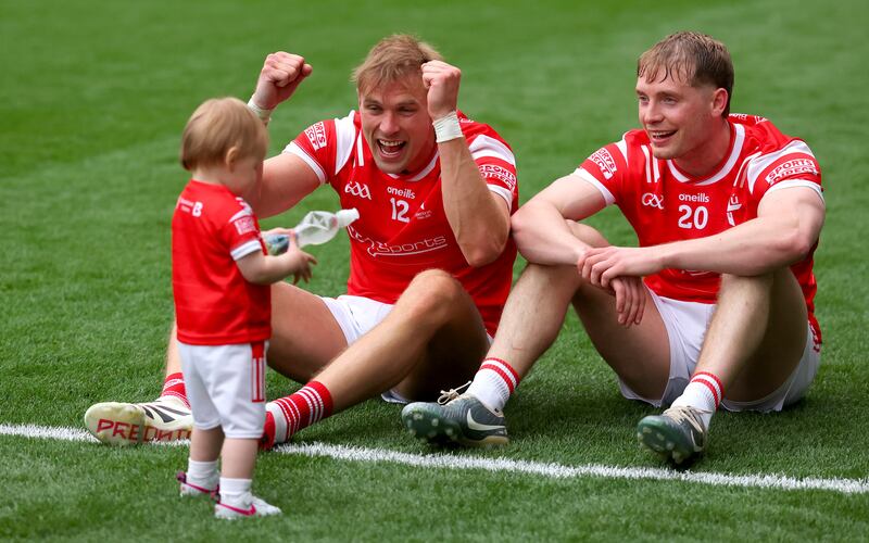 Louth’s Conor Grimes (left) and his daughter Izzy celebrate with Ciaran Byrne. Photograph: James Crombie/Inpho