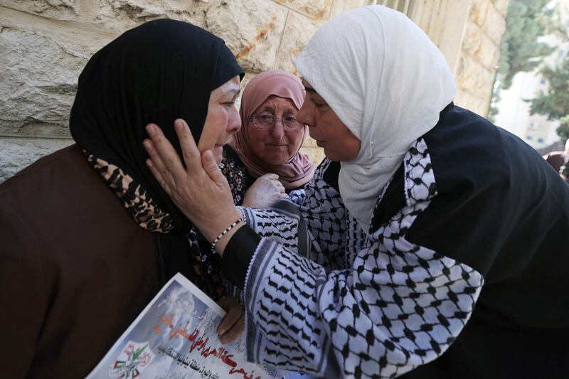 The grandmother (L) of 15-year-old Suhaib al-Sus is comforted a day after he was killed during clashes with Israeli soldiers in the Palestinian village of Beitunia, during his funeral in the West Bank city of Ramallah on October 21st, 2023. Photograph: JAAFAR ASHTIYEH/AFP via Getty Images