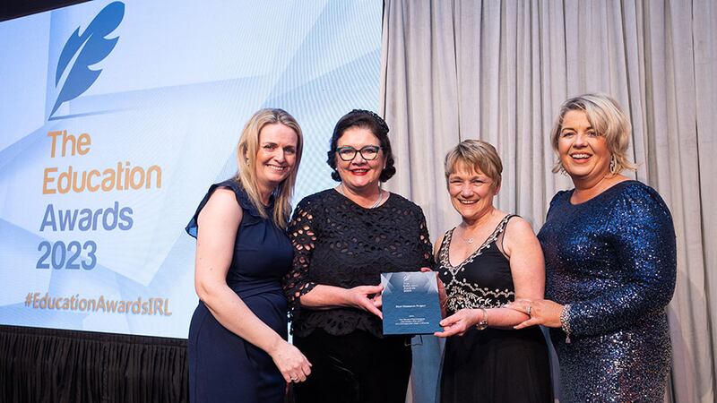 Celestine Rowland, awards judge, presents the Best Research Project award to ATU, Donegal Campus team