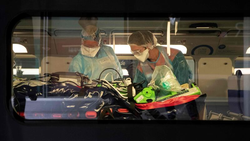 Medical staff install patients infected with   Covid-19 onboard a medicalised TGV high speed train at the Gare d’Austerlitz train station on April 1 in Paris. Patients were being evacuated from Paris’s region hospitals to other hospitals in the  Brittany region where the outbreak has been limited so far. Photograph: Thomas Samson/AFP/Getty.