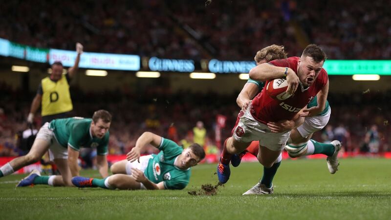 Wales wing Owen Lane dives over to score their first try. Photograph:  Stu Forster/Getty Images