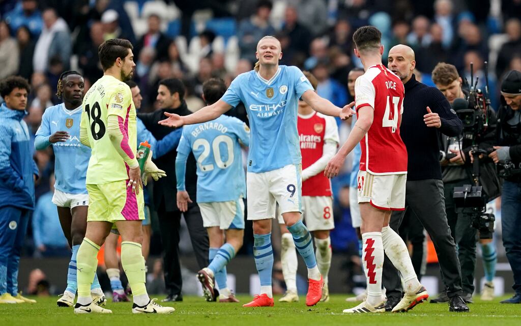 Manchester City manager Pep Guardiola speaks with Arsenal's Declan Rice following the Premier League match at the Etihad Stadium. Photograph: Martin Rickett/PA Wire