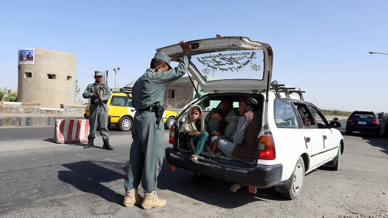 Afghan police search a car at a highway on the outskirts of Herat, Afghanistan, after an attack on foreign tourists, August 4th, 2016. Photograph: Jalil Rezayee/EPA