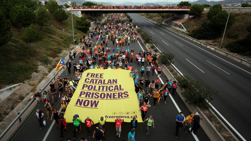 Pro-independence protesters march in Barcelona. Photograph: Pau Barrena/AFP