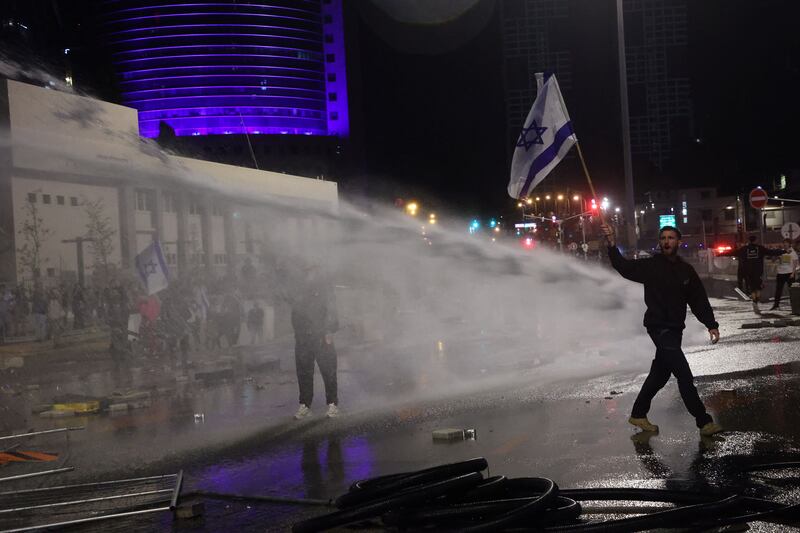 Israeli security forces using water canons on anti-government  protesters during  demonstrations in Tel Aviv on March 27th, 2023, over  judicial reforms. Photograph: Gil Cohen-Magen/AFP