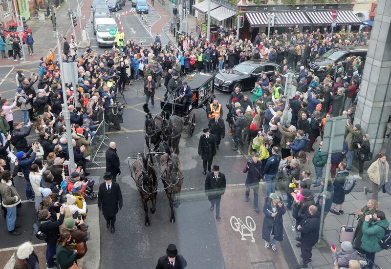 The funeral procession passes Pearse Street and Westland Row on its way through Dublin. Photograph: Alan Betson/The Irish Times

