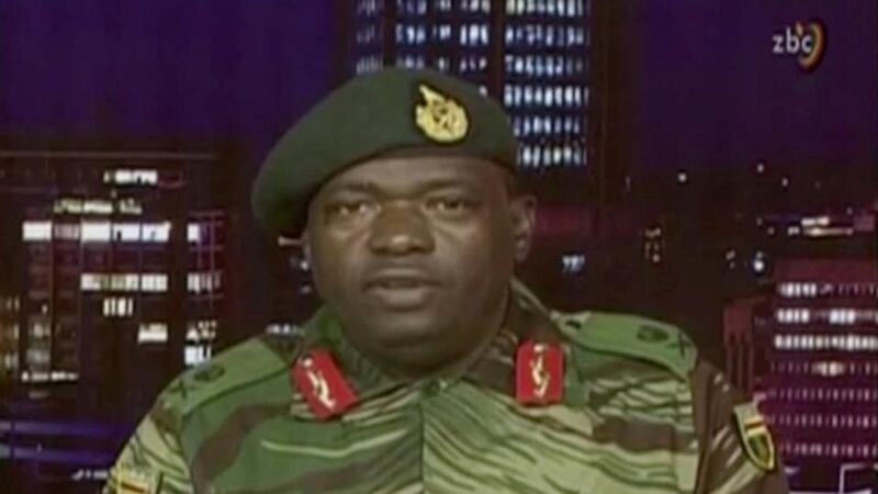 Zimbabwean coup: Gen SB Moyo appears on television on Wednesday to say the army wanted to cleanse criminal elements from the ruling Zanu-PF party. Photograph: ZBC via Reuters