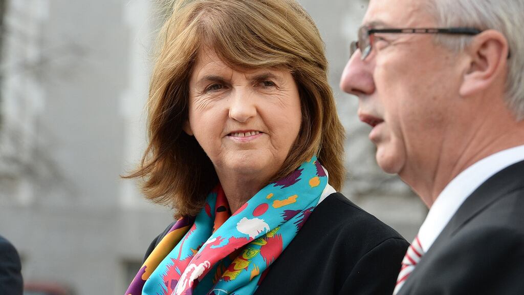 Tánaiste Joan Burton and Minister of State at Department of Social Protection Kevin Humphreys speak to reporters at the publication of the Social Welfare Bill on Friday at Government Buildings. Photograph: Cyril Byrne/The Irish Times