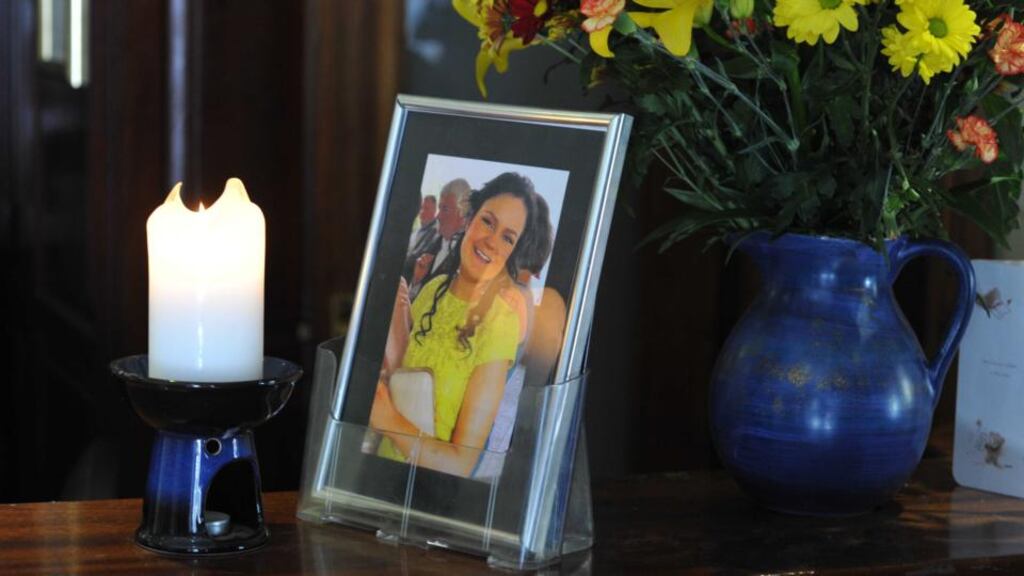 A candle lit beside a portrait of Karen Buckley in the Hibernian Hotel, Mallow, Co Cork. Photograph: Michael Mac Sweeney/Provision