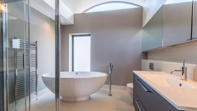 The master bedroom has an enviable ensuite, with an egg-shaped bath.