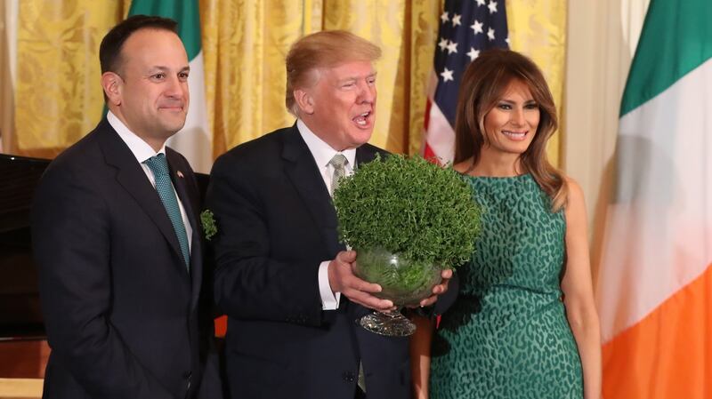 Taoiseach Leo Varadkar presents Donald Trump with a bowl of shamrock as Melania Trump looks on during the annual presentation ceremony at the White House in Washington DC. Photograph: Niall Carson/PA Wire