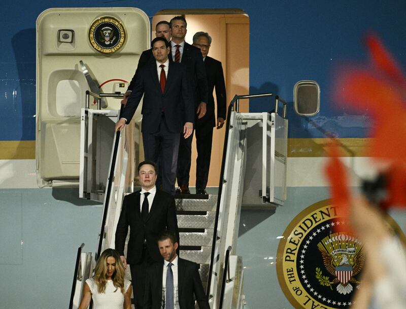 Eric and Lara Trump, SpaceX CEO Elon Musk, US secretary of state Marco Rubio, US secretary of defence Pete Hegseth and Nvidia founder and CEO Jensen Huang walk off Air Force One upon arriving at Beijing. Photograph: Brendan Smialowski/AFP/Getty Images