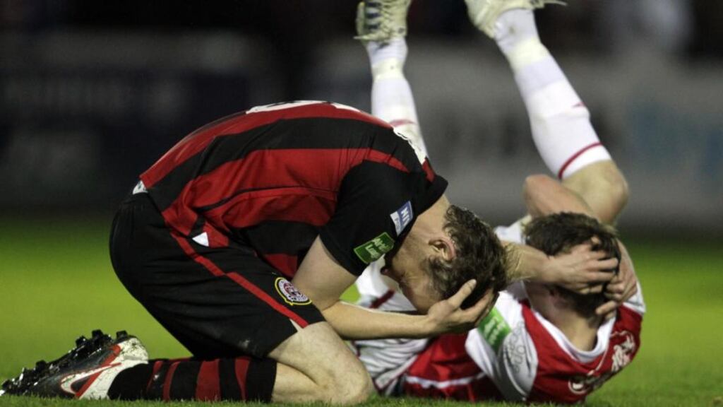 Aidan Price of Bohemians with David McMillan, then of St Patrick’s Athletic, after a clash of heads at Richmond Park, Dublin. Photograph: Inpho/Donall Farmer