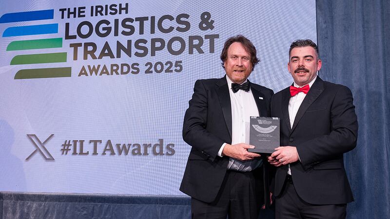Declan Allen, judging coordinator, presents the passenger transport company of the year - SME to Jerome Paul Gibson, Medicall Ambulance.