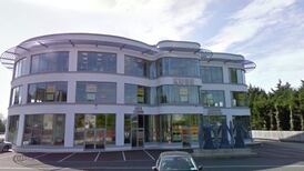 Seventy gardaí secure building occupied by three people, court told