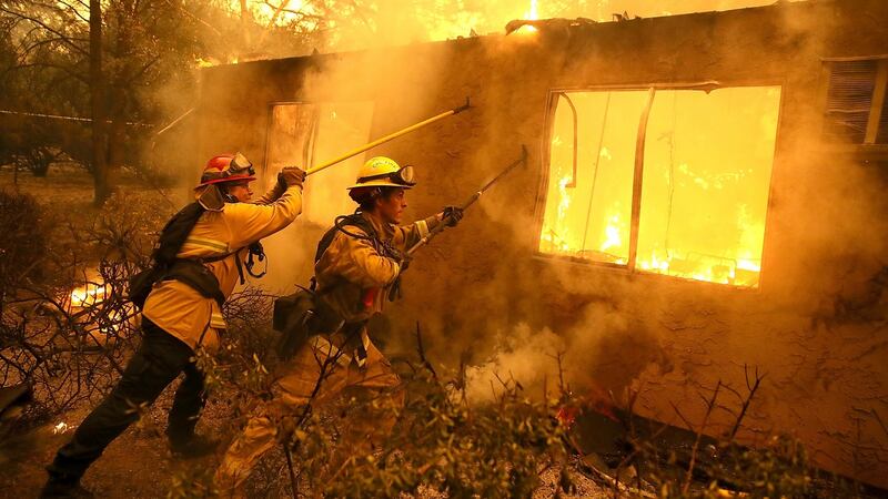 Firefighters trying to douse flames in Paradise in November 2018. Photograph: Justin Sullivan/Getty Images