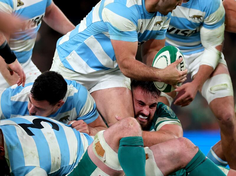 Ireland's Ronan Kelleher at the sharp end of a struggle for possession against Argentina on Friday night. Photograph: Billy Stickland/Inpho