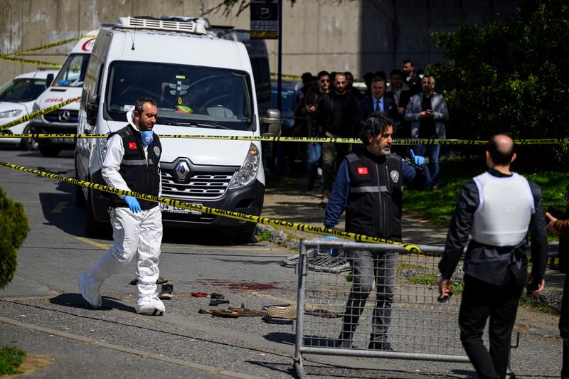 Police officials gather outside the Israeli consulate in Istanbul on Tuesday following a shootout between gunmen and police. Photo: Yasin Akgul/AFP via Getty Images