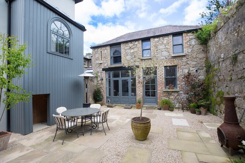 The coach house has been restored into a one bedroom guest suite 