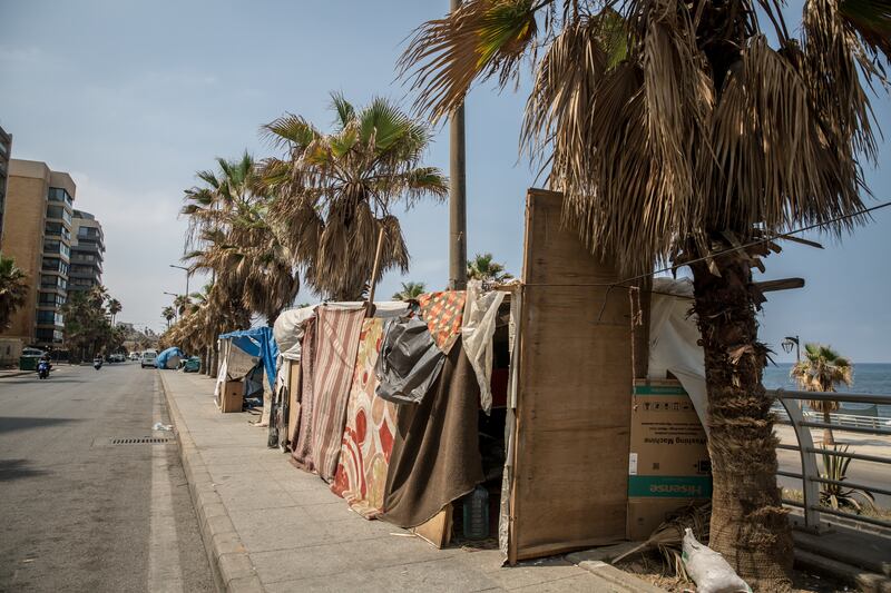 Hussein Hijazi lives alone in this tent in Ramlet al Baida, Beirut. Photograph: Sally Hayden